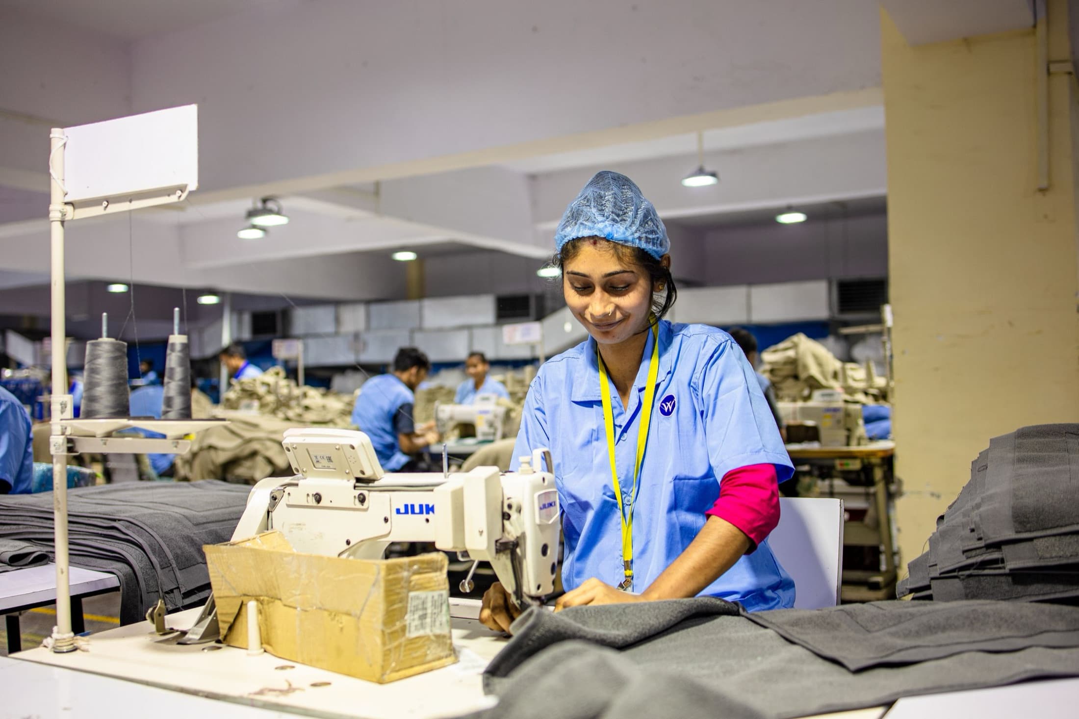Garment factory floor with sewing operators